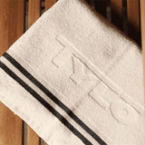 Tylö 100% Cotton Bath Towel – White with Navy Blue Stripes